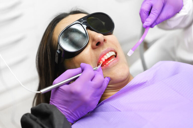 women laying in dental chair during a procedure